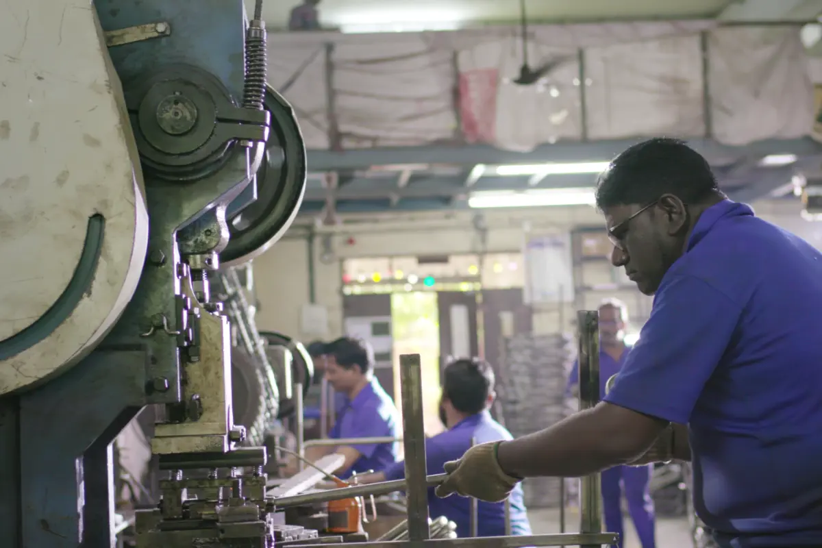CNC tube bending machine creating stroller frame components at New Natraj Industries