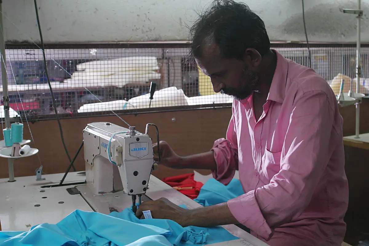 Industrial sewing machines producing baby stroller canopies at New Natraj Industries facility